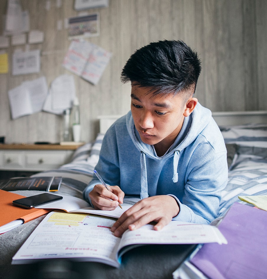 Male high school students finishing his homeworks